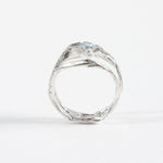 Rear view of the aquamarine ring, showcasing the organic form of the silver band