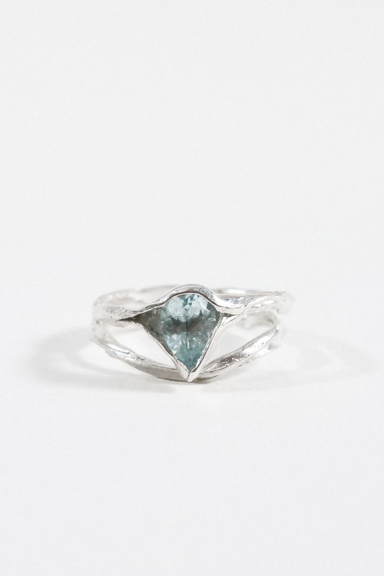 “Sterling silver ring with an aquamarine gemstone, shown front-facing on a white background.