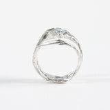 Rear view of the aquamarine ring, showcasing the organic form of the silver band