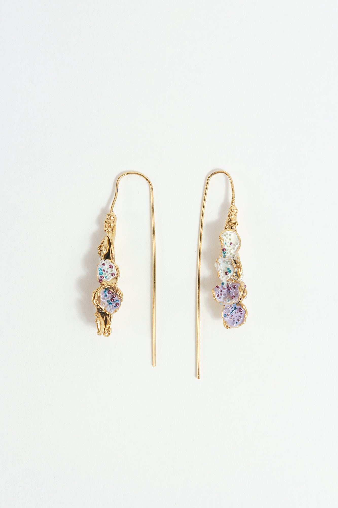 Azahar Earrings with botanical shape and handcrafted finish, presented on a white background.