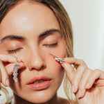 Close-up of model showing Azahar Earrings in a soft, natural setting.