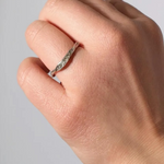 Silver ring with lab-grown diamonds worn on a finger, showing how it looks when worn.