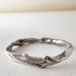 Top view of the handmade silver ring with lab-grown diamonds, displayed on a white background.
