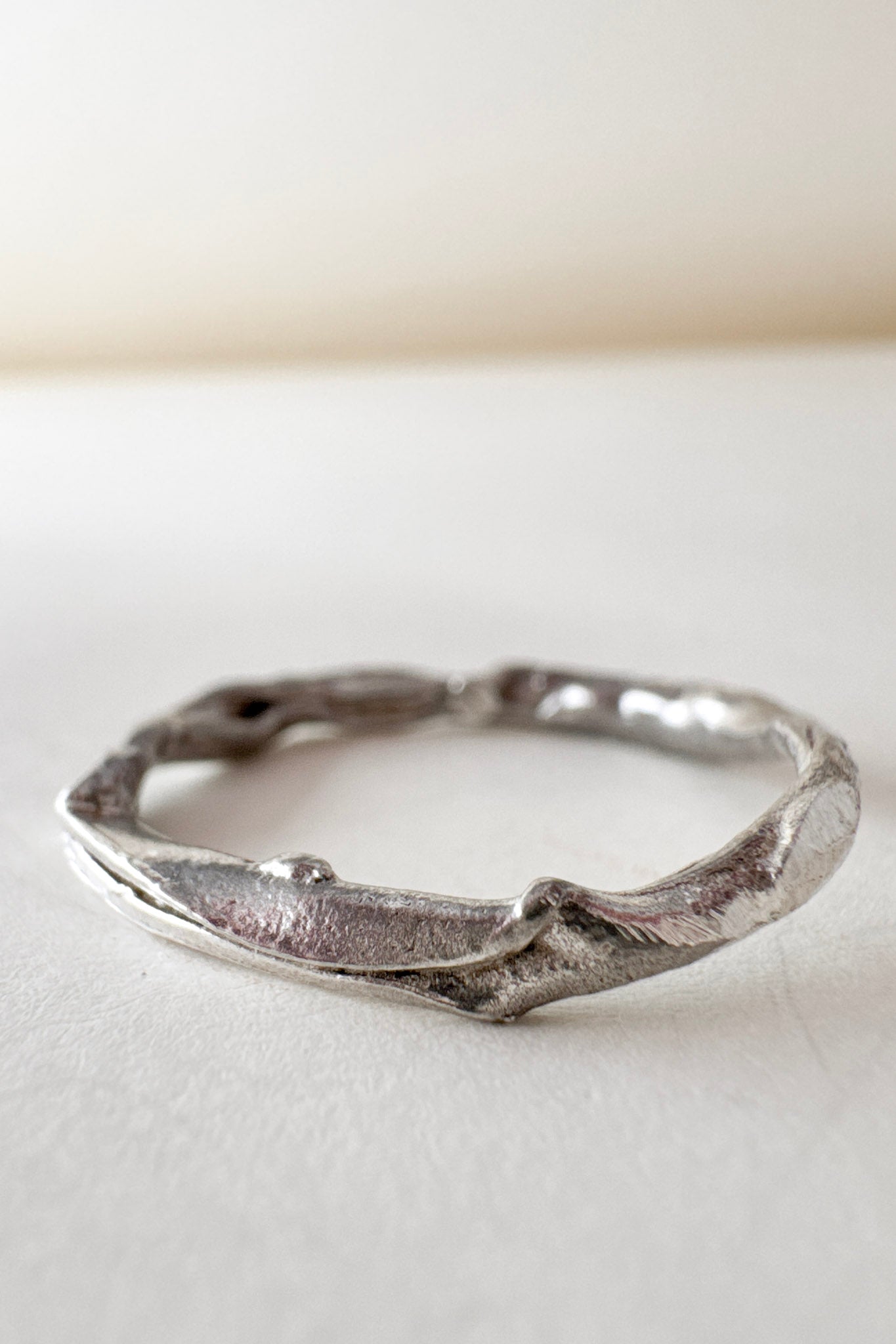 Top view of the handmade silver ring with lab-grown diamonds, displayed on a white background.