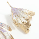 Flower Wing Earrings photographed close up, showing glass pearls and handcrafted finish