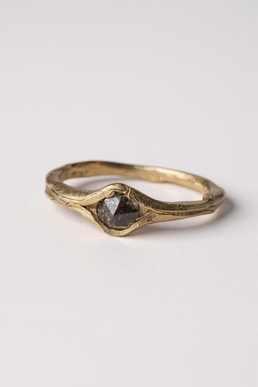Front-side view of the 10k yellow gold salt-and-pepper diamond ring on a white background.