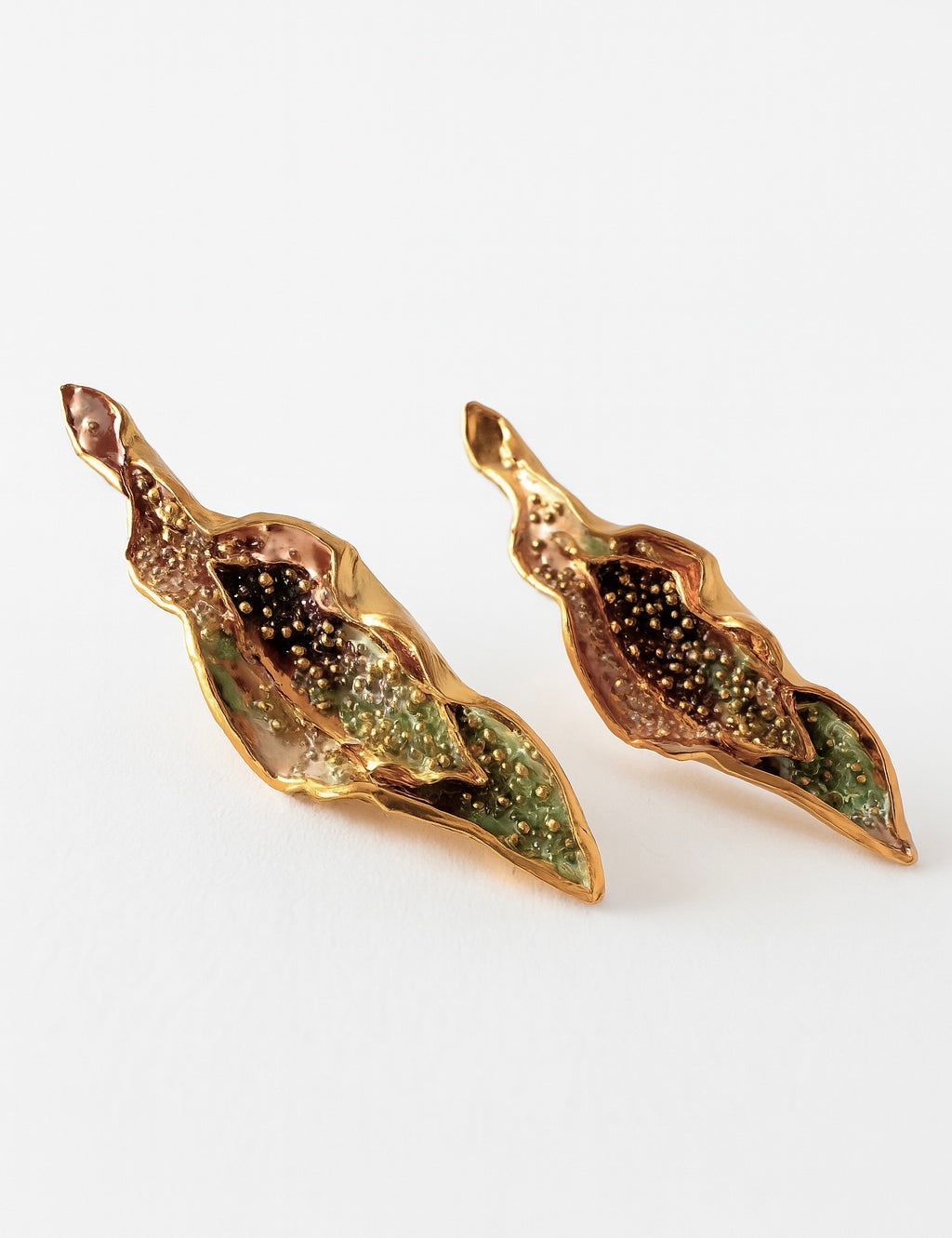 “Pair of Lettuce Leaf Earrings in gold-plated brass hand-painted  rust—with glass granulation detail, displayed on a white background.