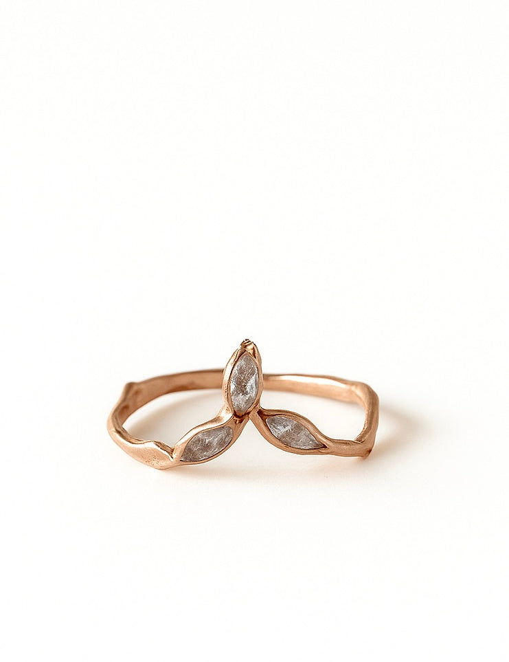 14k rose gold Marqueza ring with marquise-cut zircons on an organic sculpted band, shown front-facing on a white background.