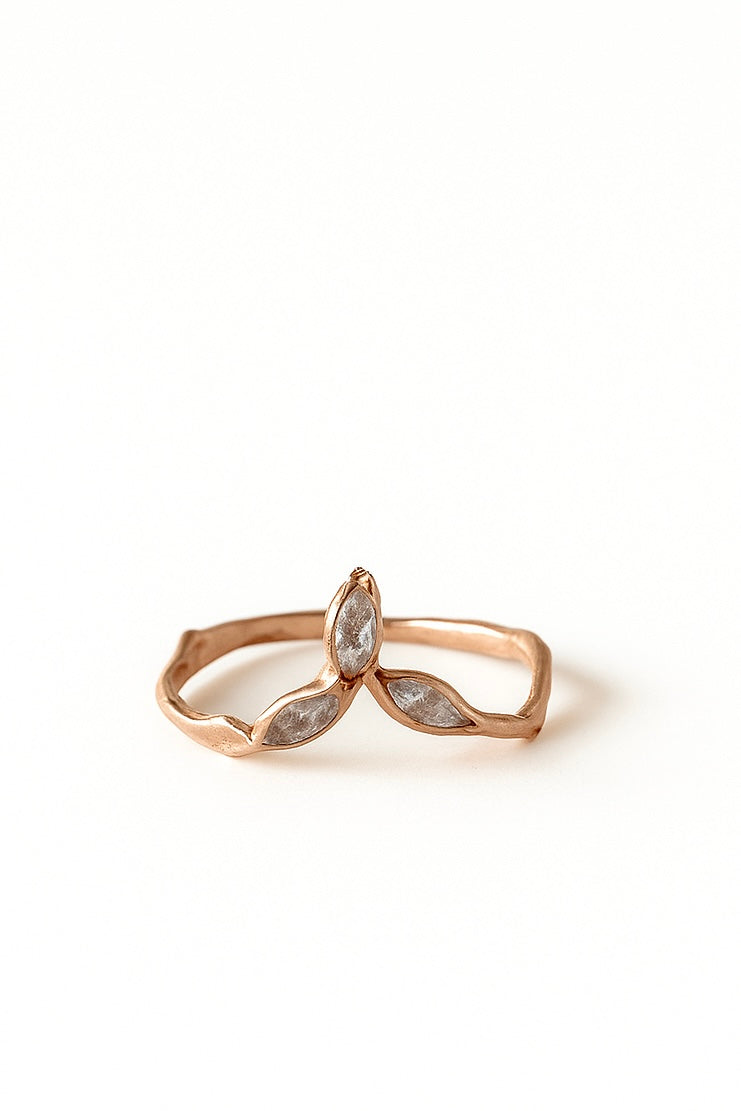 14k rose gold Marqueza ring with marquise-cut zircons on an organic sculpted band, shown front-facing on a white background.