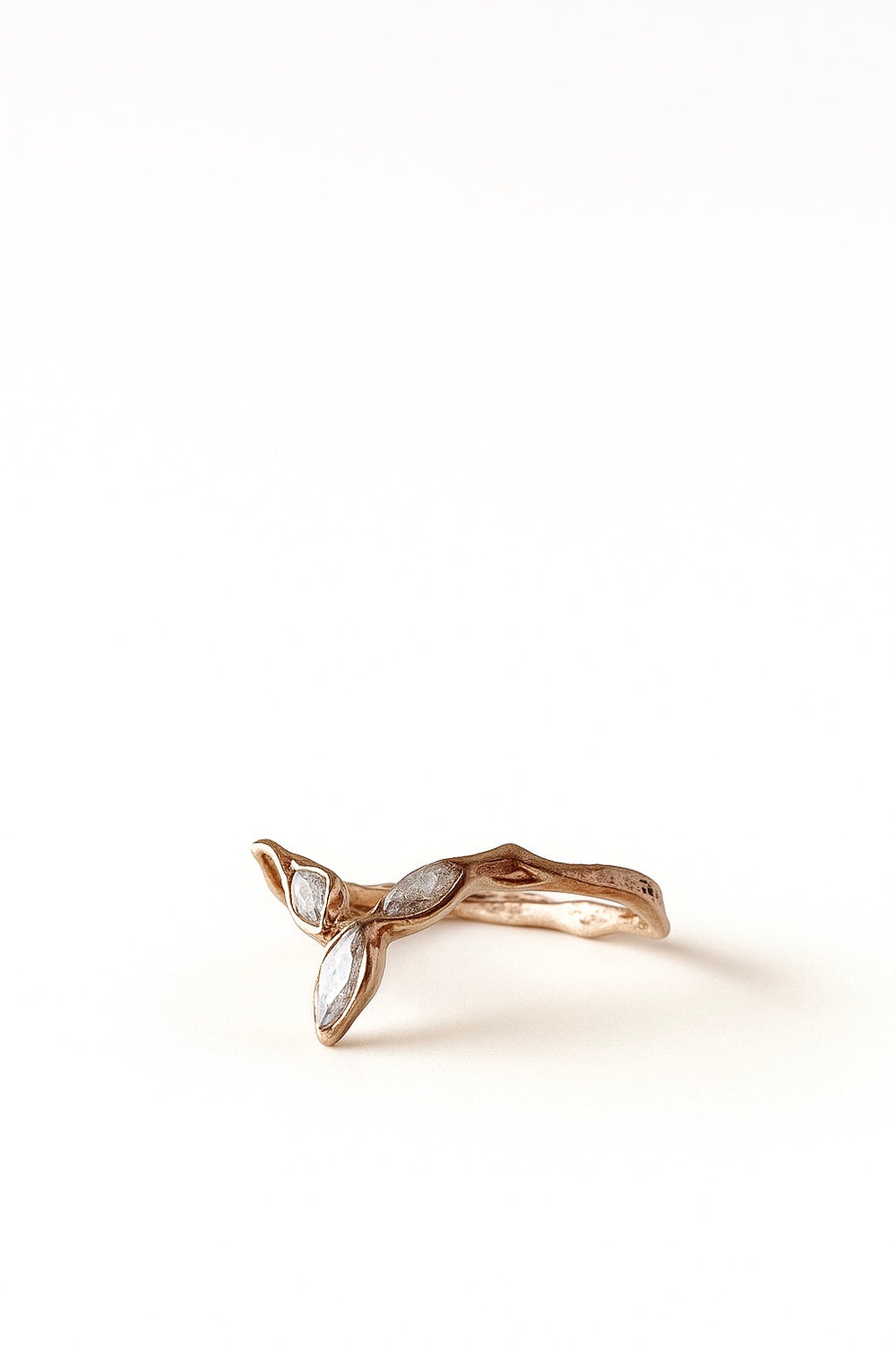 Top view of the rose gold zircon Marqueza ring highlighting its asymmetric, natural lines.