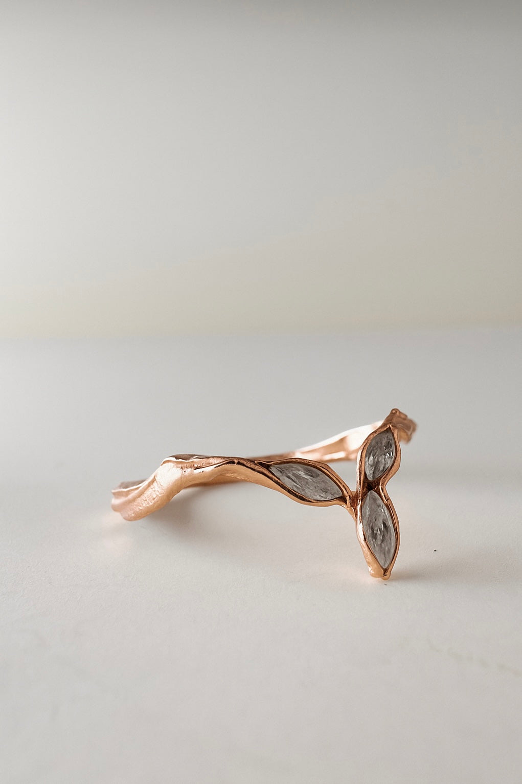 Back view of the Marqueza ring in rose gold, featuring organic hand-crafted texture and zircon setting.
