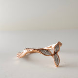 Back view of the Marqueza ring in rose gold, featuring organic hand-crafted texture and zircon setting.