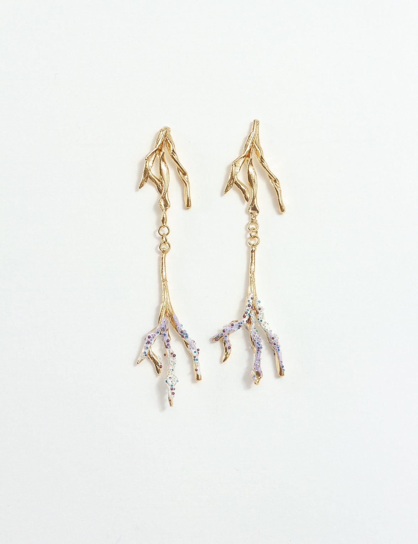 Gold-plated brass Root earrings with hand-painted lavender tips and glass granulation on a white background.