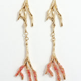 Gold-plated brass Root earrings with textured red tips and glass granulation on a white background.