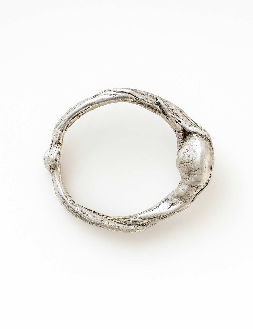 Top view of the handcrafted sterling silver ring showing its textured organic band.