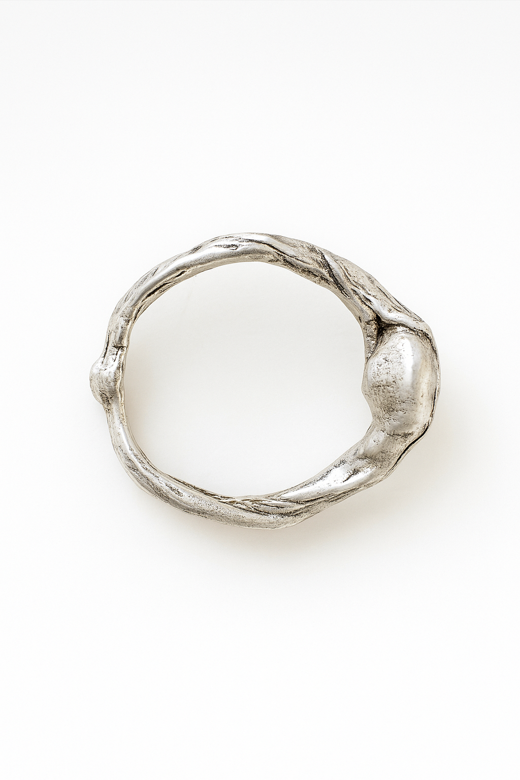 Top view of the handcrafted sterling silver ring showing its textured organic band.