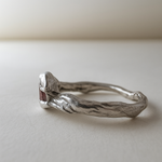 Side view of the sterling silver Sunstone ring highlighting the natural contours of the band.