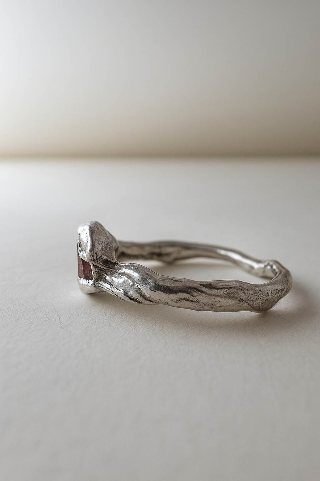 Side view of the sterling silver Sunstone ring highlighting the natural contours of the band.