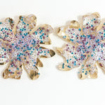 Pair of gold-plated brass Wild Clover stud earrings, viewed from the front against a white background, showing their floral shape.