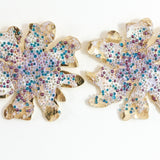 Pair of gold-plated brass Wild Clover stud earrings, viewed from the front against a white background, showing their floral shape.