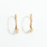 Gold hoop earrings on a white background
