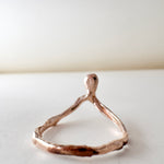 Top view of the 14k rose gold salt-and-pepper diamond ring showing its organic handcrafted design.