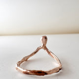 Top view of the 14k rose gold salt-and-pepper diamond ring showing its organic handcrafted design.