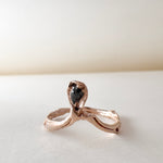 Angled close-up of the salt-and-pepper diamond set in a 14k rose gold ring, emphasizing the rustic texture and sparkle.