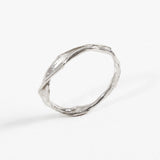 Side profile of the handcrafted sterling silver Nest Ring with a lab-grown diamond inset, resting on a white background.