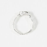 Top-down view of the handcrafted sterling silver Refuge Ring highlighting the irregular natural band.